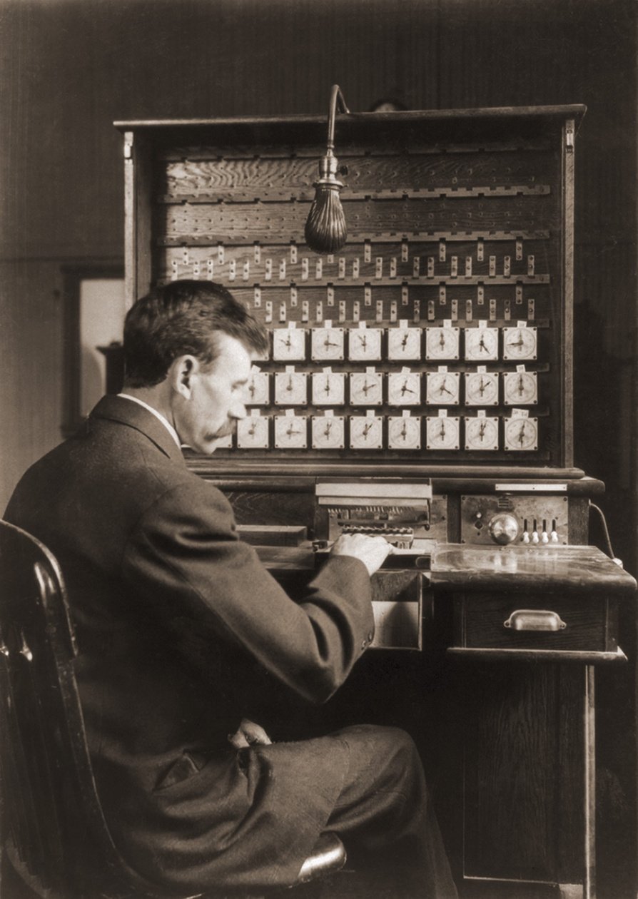 Man working with punch cards in an early tabulating machine at the U.S. Census Bureau, ca. 1908.