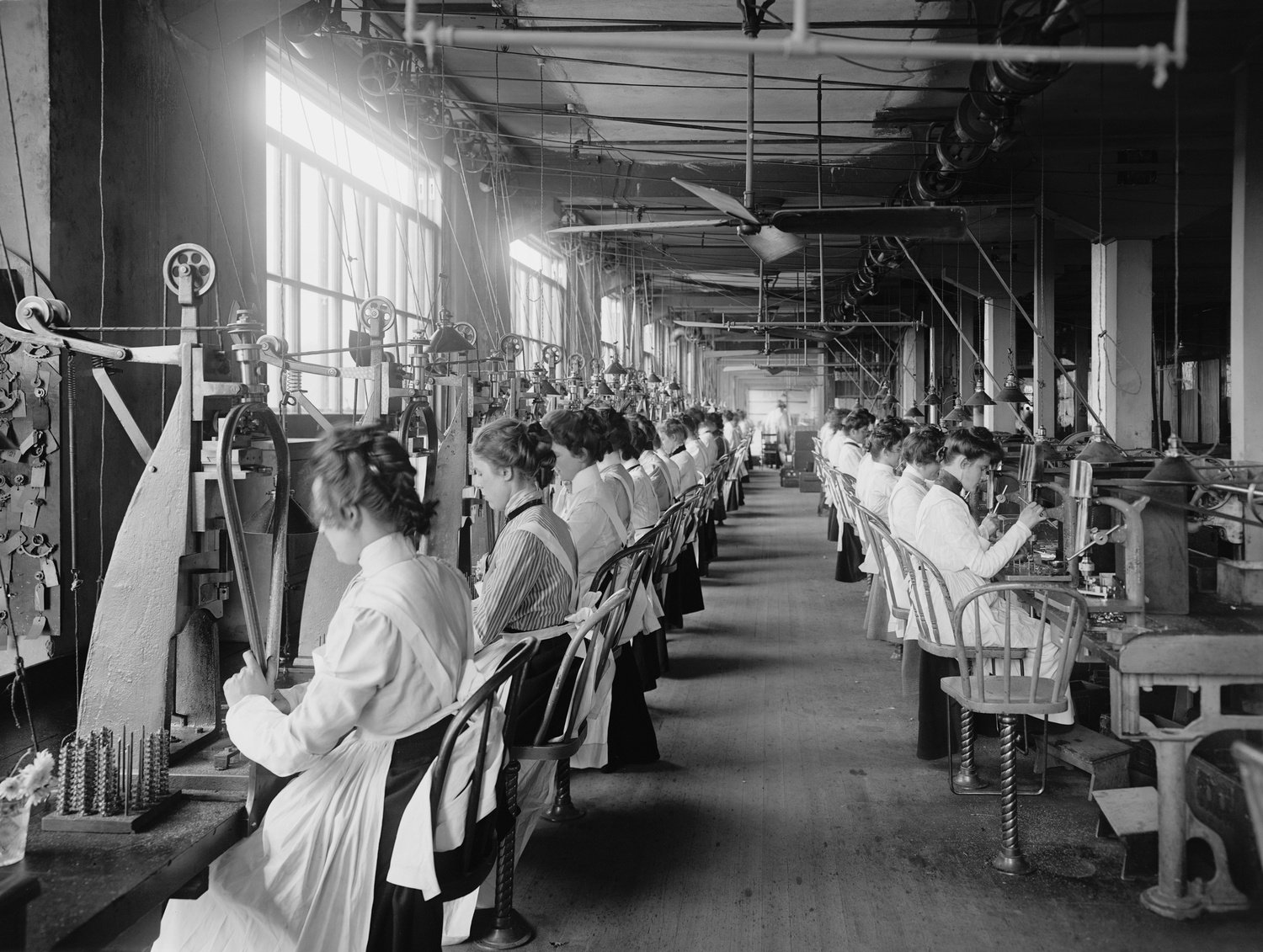 Lock and drill department assembly line of women workers at National Cash Register, Dayton, Ohio. C. 1902.